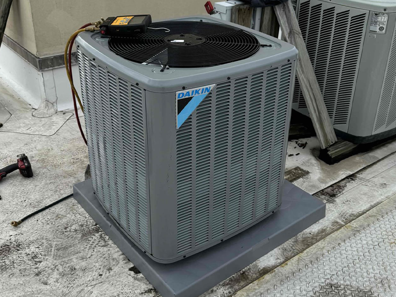 air conditioning condenser cooling on roof of Philadelphia Multi Dwelling homes